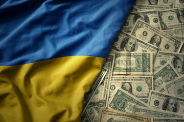colorful waving national flag of ukraine on a american dollar money background. finance concept - obrazy, fototapety, plakaty