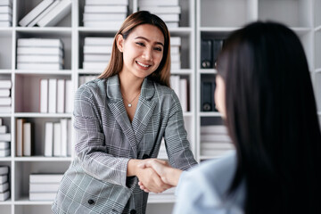 Obraz premium Business teamwork colleague concept, Business colleague shaking hands together after work successful about collaboration to brainstorming and discussing about strategy of new startup