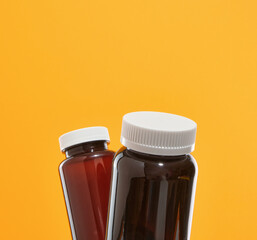 Concept of healthcare and medicine. Pills and capsules in medical jars.