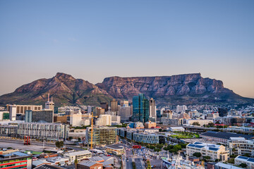 Wide angle shot of Cape Town city central business district and table mountain in the background during sunset, South Africa