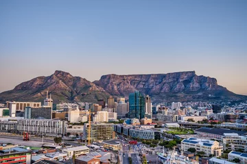 Fotobehang Tafelberg Wide angle shot of Cape Town city central business district and table mountain in the background during sunset, South Africa