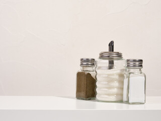 Dinner party. Salt, sugar and ground black pepper on table at the cafe. Copy space for text.