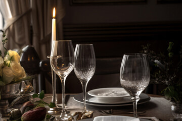 Elegant table setting with candles in restaurant. Selective focus. Romantic dinner setting with candles on table in restaurant. 