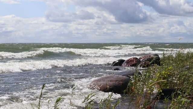 Hindens rev at V&auml;nern. The biggest lake in Sweden. Large wet rocks. Windy outside this summer day. Near Lidk&ouml;ping.