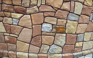 Split red natural stone is used in construction