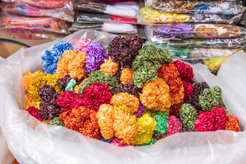 Colorful hair ties for sale at a market in Srinagar.