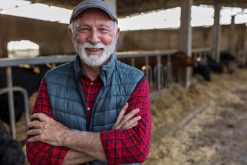 Farmer standing in front of cattle ranch