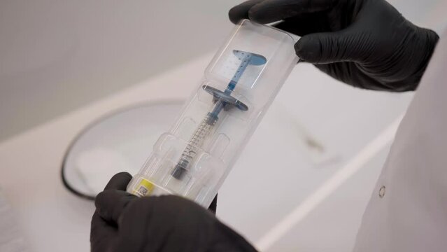 Close up is a medical syringe in a package