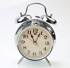 Retro alarm clock on plain background