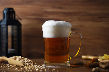 cold beer glass with foam on top , fresh summer beverage, pub and bar concept wallpaper