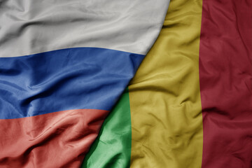 big waving realistic national colorful flag of russia and national flag of mali .