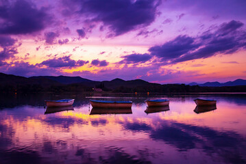 Beautiful lake in the mountains at sunset. Sunset reflections in the lake of Banyoles - Girona - Spain