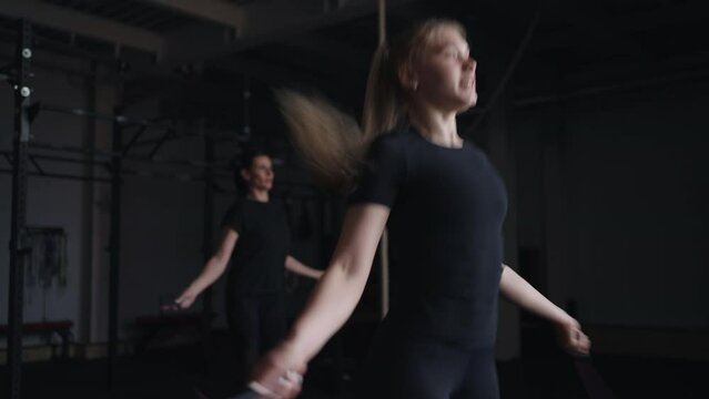 Young Blonde Woman Skipping Rope In Gym, Cardio Workout And Warming Before Training