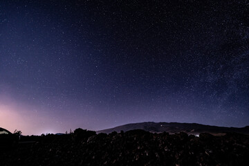 Stargazing at Mauna Loa Observatory Road, Big Island Hawaii. Starry night sky, Milky Way galaxy astrophotography. Mauna kea. Ursa Minor and Ursa Major © youli