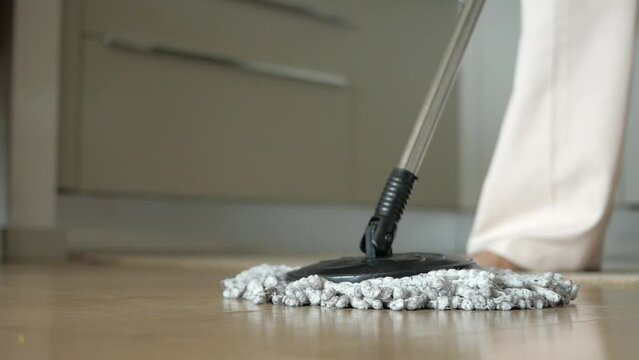 cleaning tiles floor with mop 