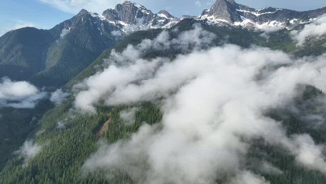Clouds and forest-covered mountain slopes are found in North Cascades National Park. This mountainous region of northern Washington is absolutely beautiful and easily accessed during summer months.