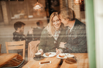 Mature couple having coffee and spending time together at an indoor cafe