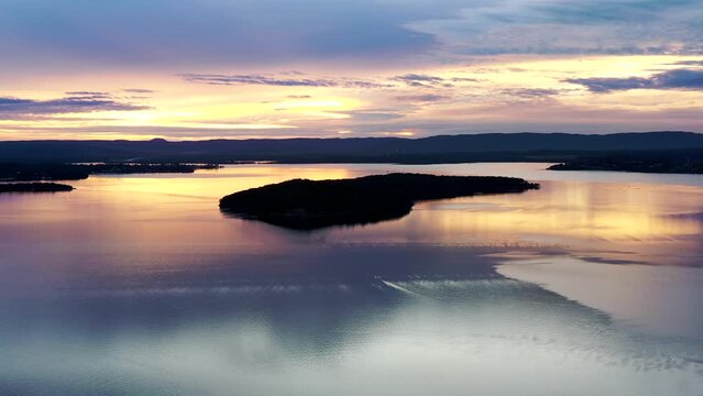 Dangar island on Lake Macquarie Australian Pacific coast in aerial sunset 4k.
