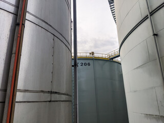 Naklejka premium View from under the large crude palm oil storage tank