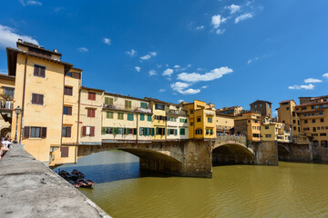 Fototapeta na wymiar Florence, Italy - June 28, 2023: Florence, Italy on the Arno River. View of Ponte Vecchio bridge.