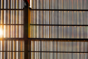 Background of window blinds with sun light in the morning