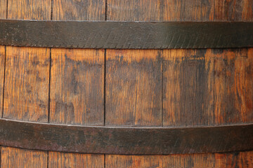 Traditional wooden barrel as background, closeup. Wine making