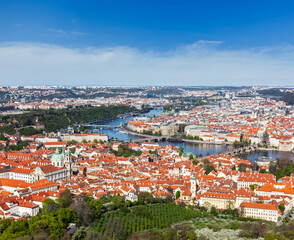 Fototapeta na wymiar Aerial view of Charles Bridge over Vltava river and Old city from Petrin hill Observation Tower. Prague, Czech Republic