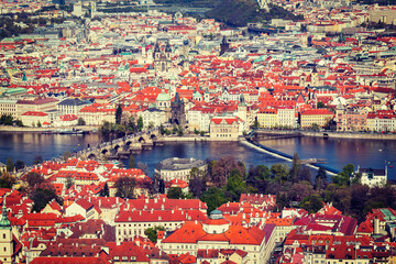 Vintage retro hipster style travel image of aerial view of Charles Bridge over Vltava river and Old...