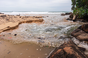 waste on beach, dirty sea pollution, garbage on beach after low tide, environmental pollution, water erosion, abrasion platform