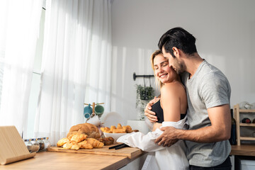 Caucasian young hot sexy couple baking bakery foods in kitchen at home. 