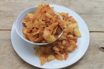 French fries in plate and bowl on table