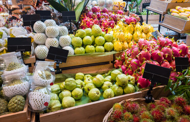 Various of fresh fruits on shelf in modern supermarket.