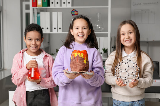Little children with chemistry equipment in science classroom