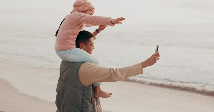 Selfie, playful and a father and child at the beach for a video call or online communication. Happy, playing and a dad taking a photo at the ocean with a child for social media or vacation memory