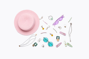 Accessories with sunglasses and summer hat on white background