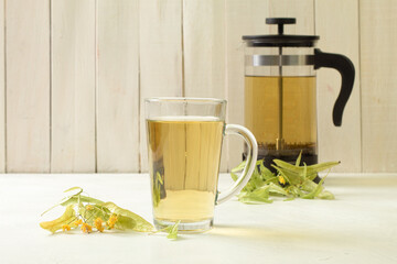 A glass of linden tea, herbal medicinal decoction