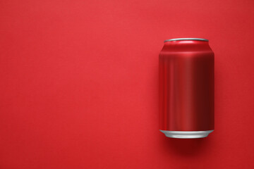 Can of soda on red background