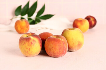 Naklejka na ściany i meble Sweet peaches and leaves on white table