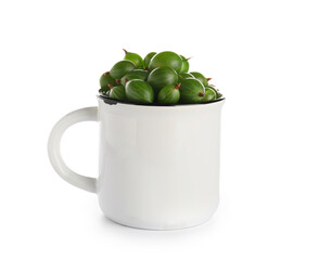 Cup with fresh gooseberries on white background