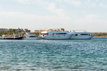 Tourist boat silhouetts on the shores of the red sea in Makadi Bay Egypt