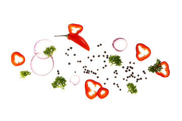 Flying peppercorns, chili pepper, parsley and onion on white background