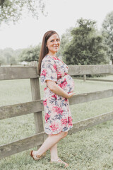 Pregnant Woman in Floral Dress Outside