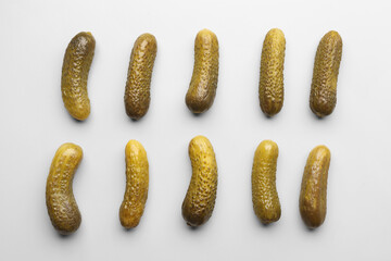Pickled cucumbers on grey background