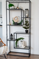 shelves with christmas decorations and small interior items