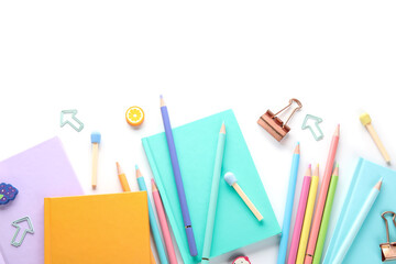 Notebooks and school stationery on white background