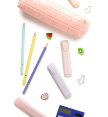 Pencil case and school stationery on white background