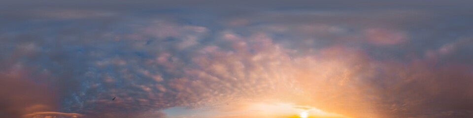 Sunset sky panorama with dramatic bright glowing pink Cumulus clouds. HDR 360 seamless spherical panorama. Full zenith or sky dome for 3D visualization, sky replacement for aerial drone panoramas.