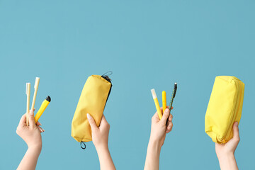 Female hands with school supplies on blue background - Powered by Adobe