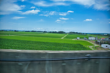 A view from inside a Shinkansen train in Japan.