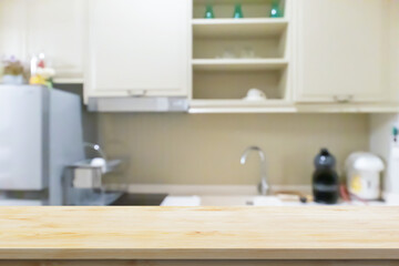 Black wood counter top with blurred kitchen background